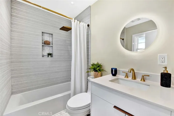 Primary Bath has a Tub/Shower Combinations with Marble Surrounds with INlay and Shampoo Niches, ALL New Vanities, Mirrors, Lighitng & Fixtures.