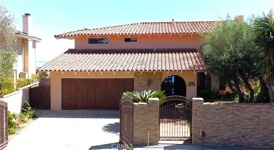 Front of Home Gated driveway