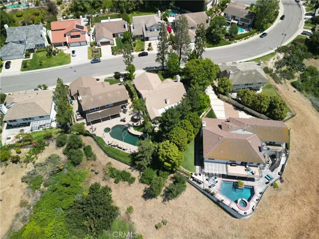 Property is Second from Right in the Tree-Lined Area "between" the Two Pool Homes.