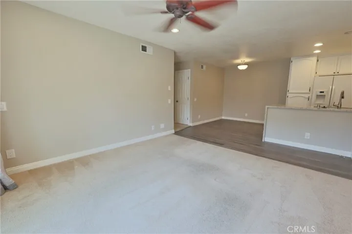 Living room opens to dining room and kitchen