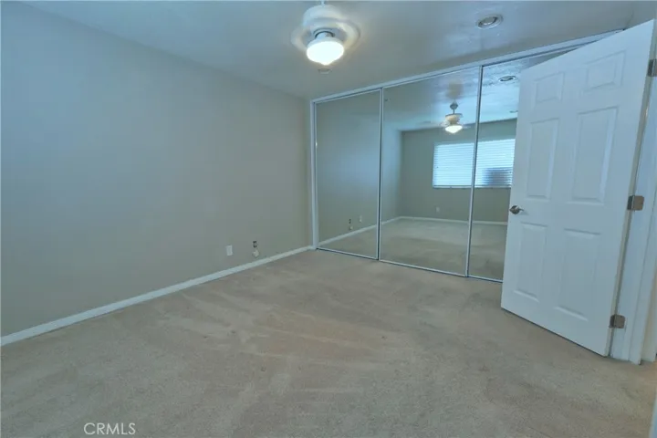 Mirrored wardrobe in primary bedroom