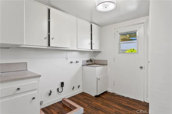 Indoor laundry with access to the side yard.
