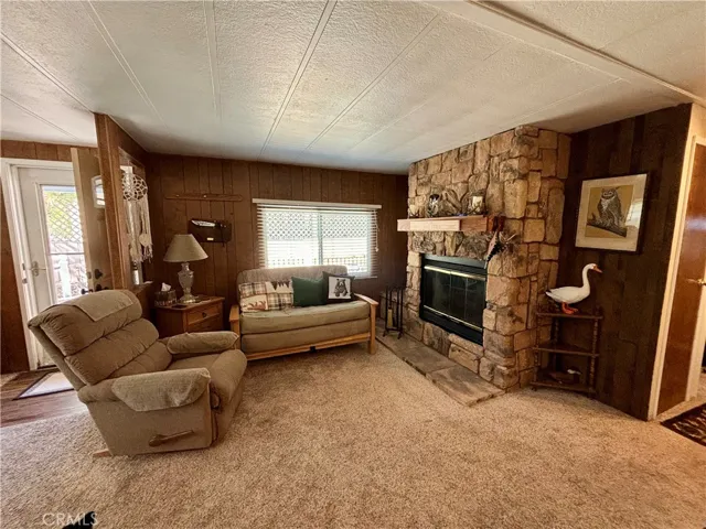 Living room has a cozy gas fireplace