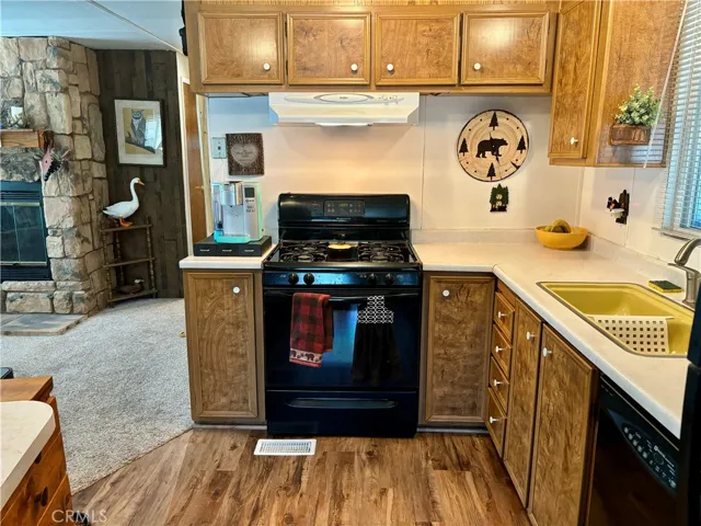 Convenient kitchen with dishwasher, gas stove/oven refrigerator and butler's pantry.