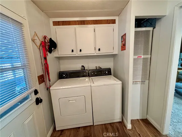 Laundry room has room for a computer table and extra storage