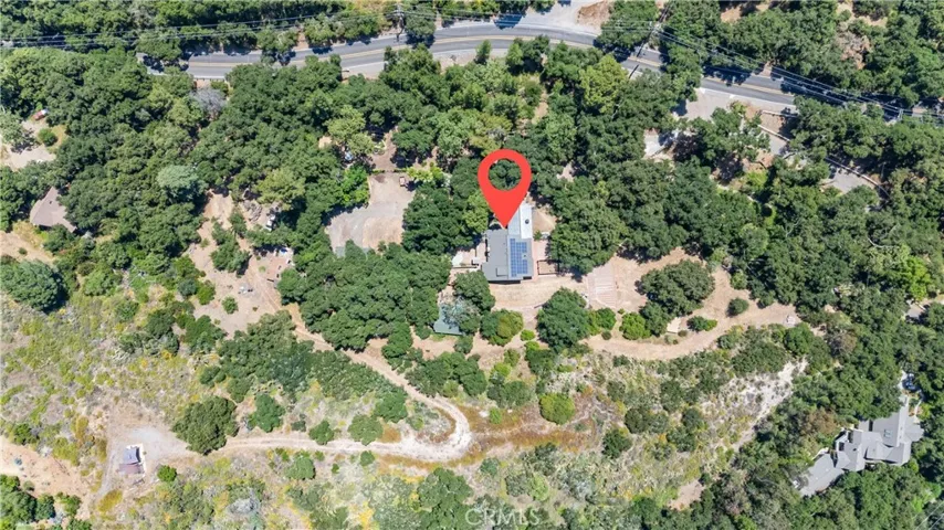 Aerial view.   Gazebo in bottom left, main residence in the middle, Live Oak Canyon Road at the top