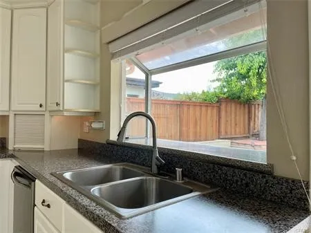 Great Open Gourmet Kitchen....Stainless Steel Sink and newer Euro Faucet....Green House window looking out on the huge enclosed  fenced Low Maintenance Yard.
