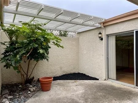 Large Family ROOM .."Great Room" with a skylight and Custom Light...Looks out on the enclosed maintenance  Backyard and ATRIUM....This room separates the Master suite to the 2 second bedrooms...
