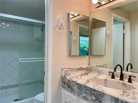 Custom Bathroom with full length custom tile, Glass door shower .