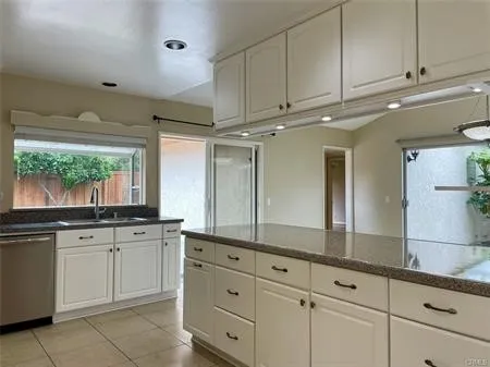 Spacious Kitchen open to the Family room....See under the CABINET stowaway for your coffee, pastries or breads.