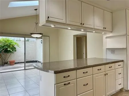 Spacious Kitchen open to the Family room....See under the CABINET stowaway for your coffee, pastries or breads.
