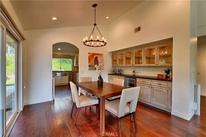 dining room with built in cabinets and wine frig