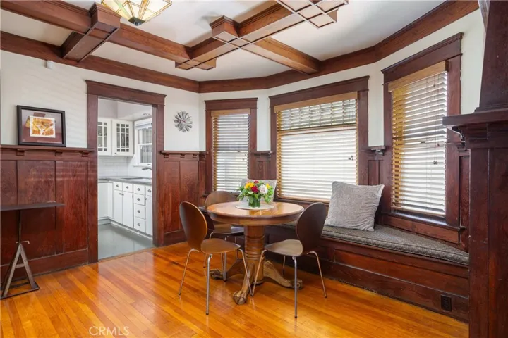 Dining area, right side. Bay window with bench seat. View of entrance to kitchen