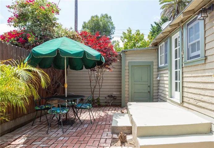 Backyard, view towards garage side door and kitchen back door
