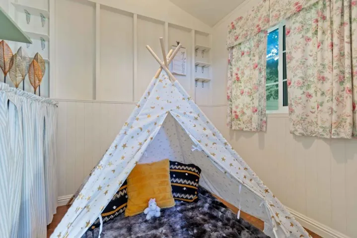 Play room for kids? Small office? In very back of backyard.