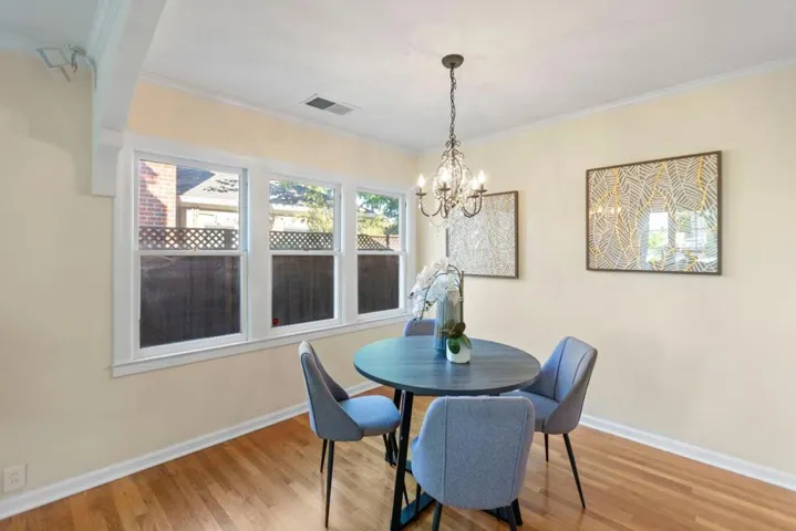 Dining room with hardwood and built in cabinets