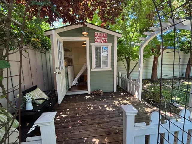 Play room for kids? Small office? In very back of backyard.