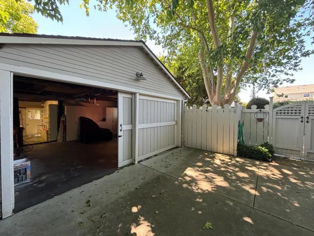 Detached 2 car garage with multiple additional spaces to park on long driveway