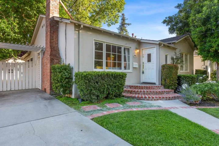 Charming front entry, long driveway is gated for extra parking