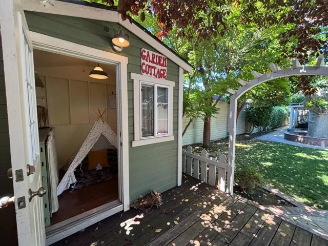 Play room for kids? Small office? In very back of backyard with its own deck!