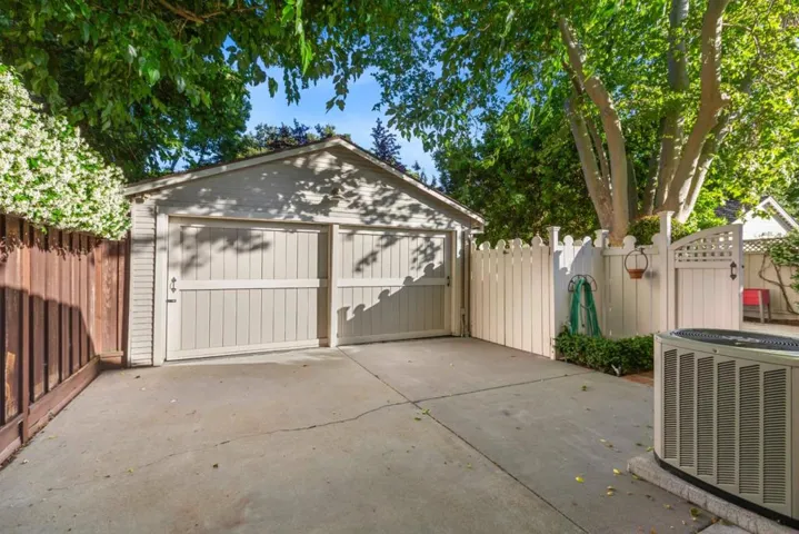 Detached garage down gated driveway