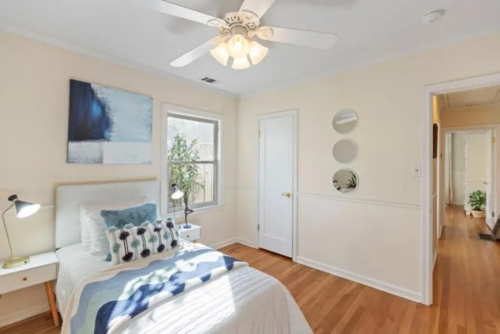 2nd bedroom with French Doors to back yard. Stairs to extra attic space are in closet