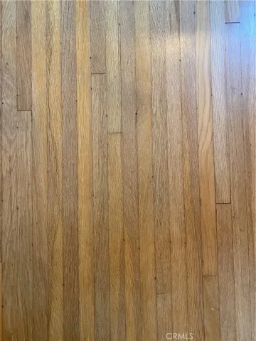 Narrow strip Oak floors.