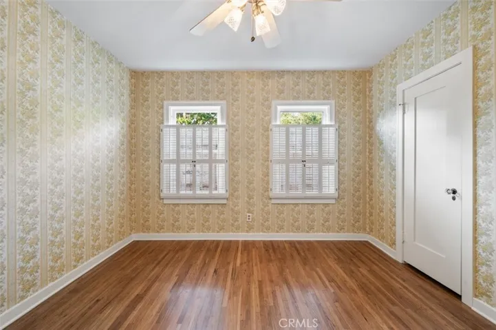 Bedroom #1 with vintage wallpaper.