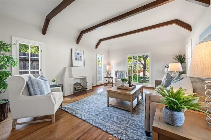 10' ceiling with original stenciled beams and a lofty feel to the Living room.