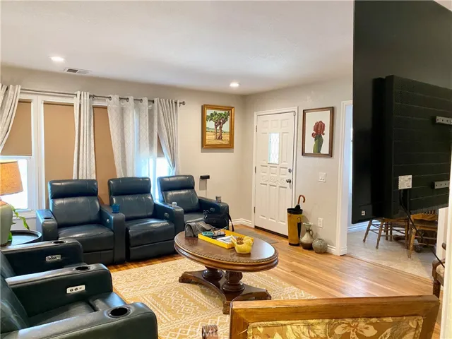 Living room with front door entry