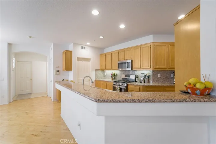 Huge kitchen with loads of counter and cooking space and an eat up to bar!