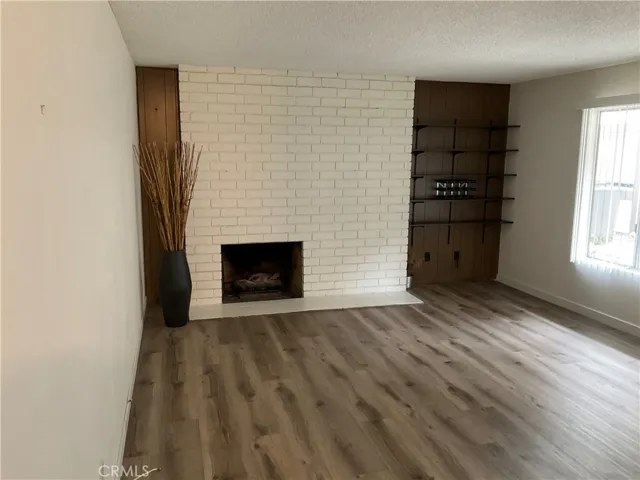 Living Room with Fireplace and shelves