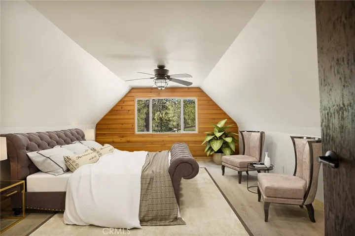 Upper level primary, spacious bedroom #2.   NOTE: This photo has been virtually staged to offer a preview of furniture placement, providing an insightful perspective for arranging your living space.