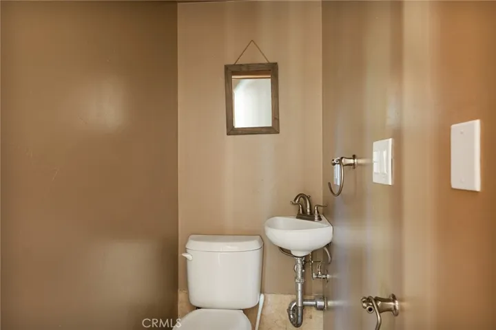 1/2 bathroom past the refrigerator near the exterior door for easy acess to spa and outdoor living area.