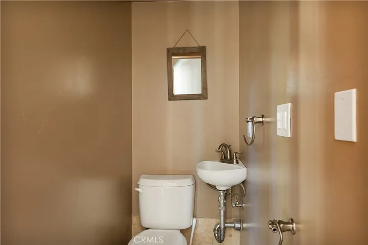 The main level offers a 1/2 powder bathroom next the kitchen.