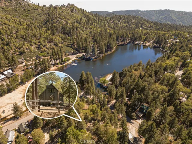 The cabin is located across the lake.