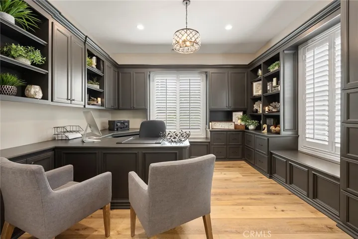 Executive Office with all kinds of cabinets and shelving.