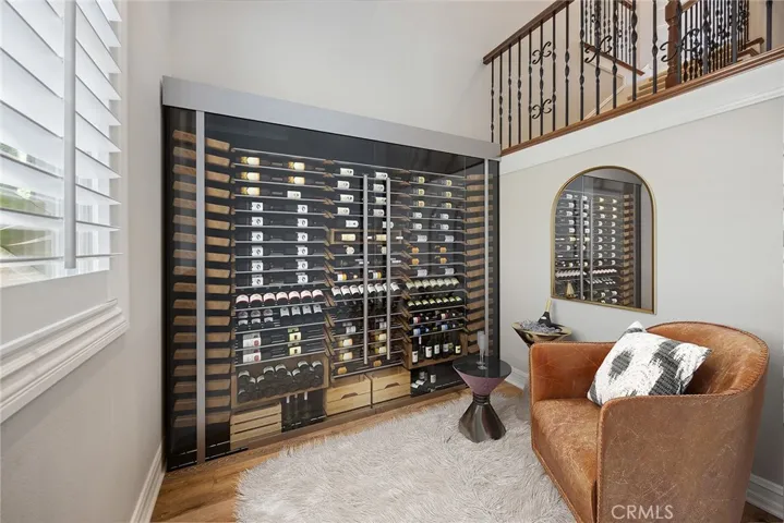 Wine Refrigerator under Back Stair Case - Virtually Staged