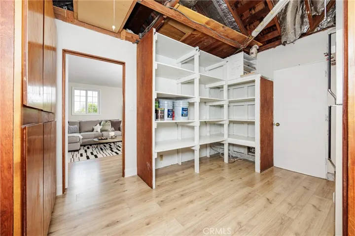 Laundry room with storage area & attic