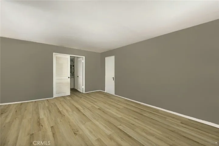 *Edited Photo*Living Room reimagined with neutral paint and flooring*For reference only-home is occupied.
