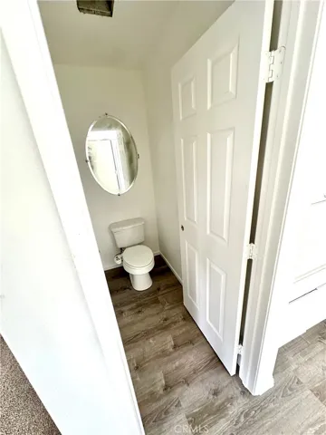 1/2 bath downstairs with new flooring, new paint, new light fixture