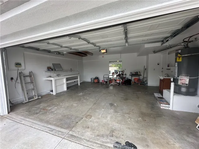 garage with access into living room and side door to back yard.