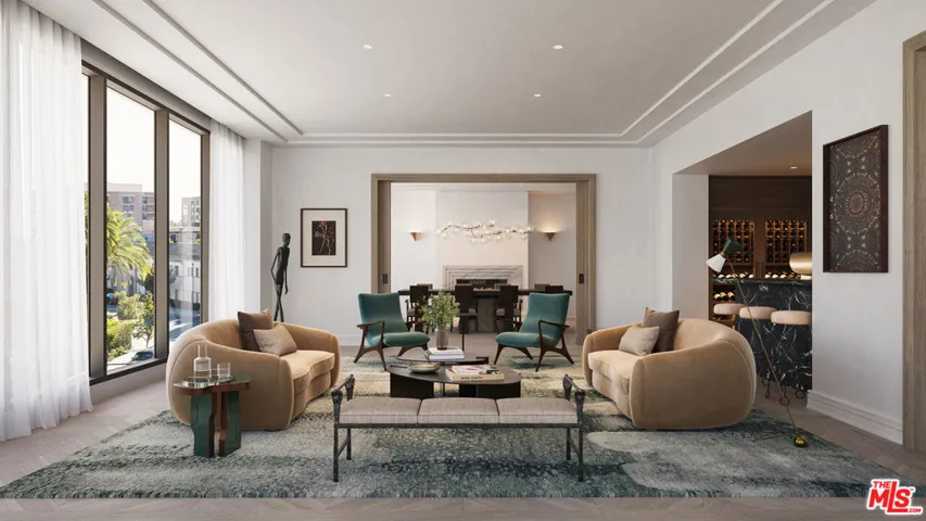 Gracious Great Room Flanked by Custom Wet Bar & Dining Room with Fireplace