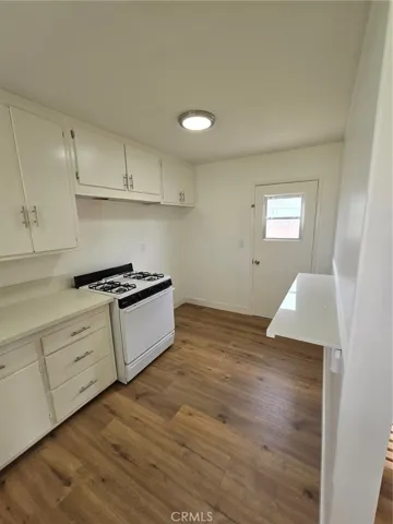 Kitchen as approached from the front door, side yard door in view...sharp left out that door takes you right to the garage