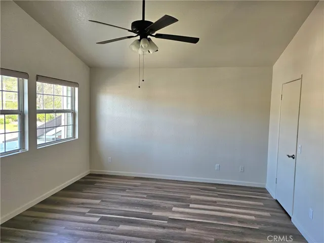 Primary bedroom with ceiling fan