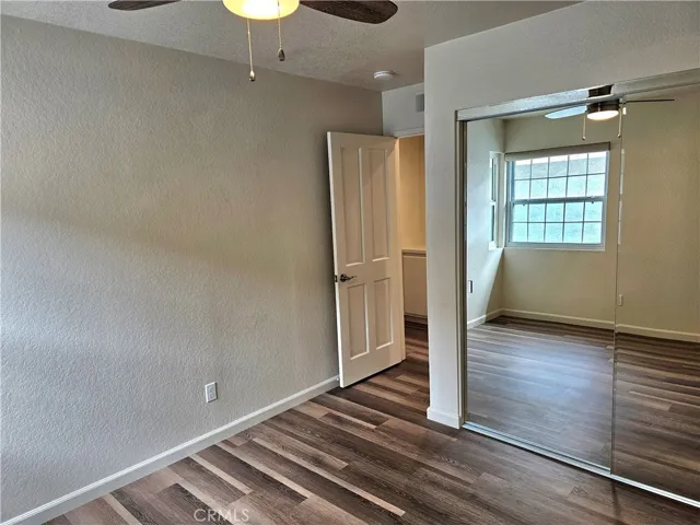 Secondary bedroom with mirrored closet doors