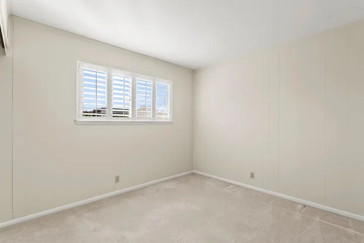 Smaller secondary bedroom facing pool