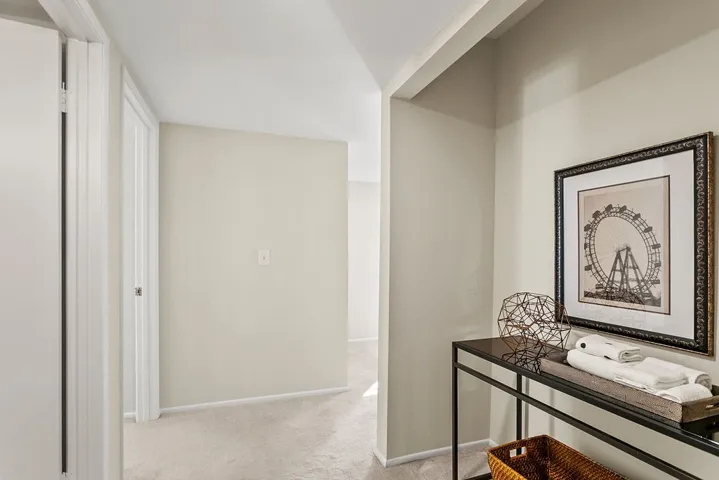 Hall open closet adjacent from bathroom