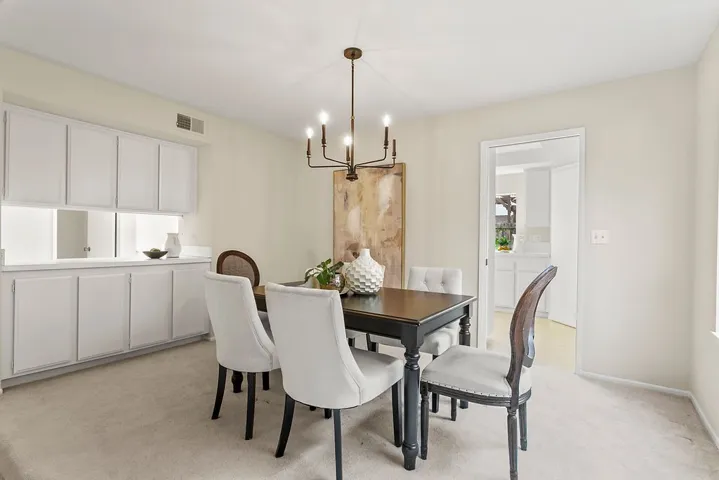 Built in dining storage and space to lay out all the buffet! Door leading to the kitchen