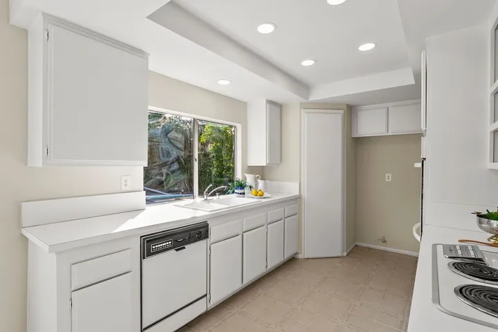 Kitchen window to backyard and walk in pantry back left